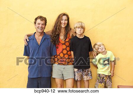 Stock Image - portrait of parents with young sons. Fotosearch