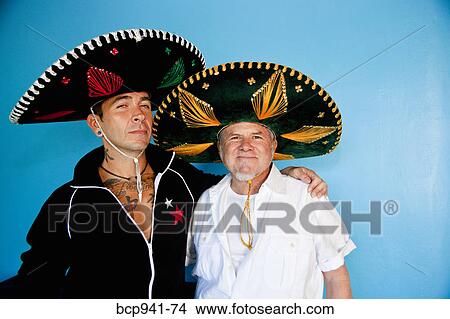 Picture - portrait of two men wearing sombreros. Fotosearch