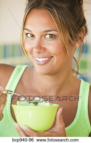 Stock Photograph - woman eating ice cream. Fotosearch