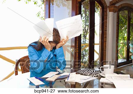 woman paying bills at dining room table View Large Photo Image Stock Photo - woman paying bills at dining room table. Fotosearch