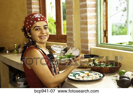 woman preparing food in kitchen View Large Photo Image Stock Photo - woman preparing food in kitchen. Fotosearch