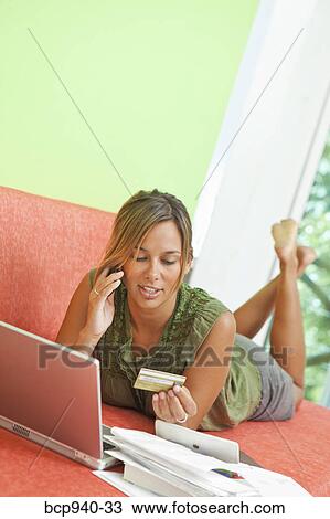 Stock Image - woman shopping online. Fotosearch