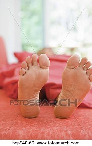woman sleeping with feet out from covers View Large Photo Image Stock Image - woman sleeping with feet out from covers. Fotosearch