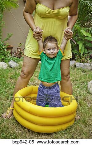 woman with young boy playing in pool View Large Photo Image Stock Photography - woman with young boy playing in pool. Fotosearch