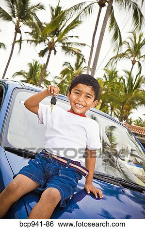 young mexican boy holding car keys View Large Photo Image Stock Photograph - young mexican boy holding car keys. Fotosearch