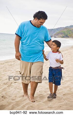 young mexican father and son on beach View Large Photo Image Stock Image - young mexican father and son on beach. Fotosearch