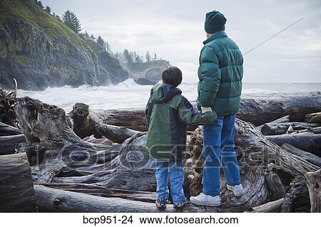 boy and woman looking at lighthouse View Large Photo Image Picture - boy and woman looking at lighthouse. Fotosearch