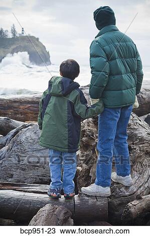 boy and woman looking at lighthouse View Large Photo Image Stock Image - boy and woman looking at lighthouse. Fotosearch