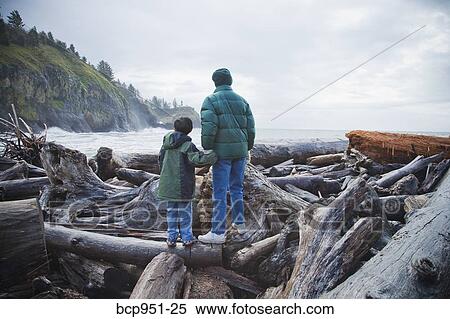 boy and woman looking at lighthouse View Large Photo Image Stock Photography - boy and woman looking at lighthouse. Fotosearch