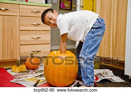 boy carving jack o'lantern View Large Photo Image Stock Image - boy carving jack o'lantern. Fotosearch