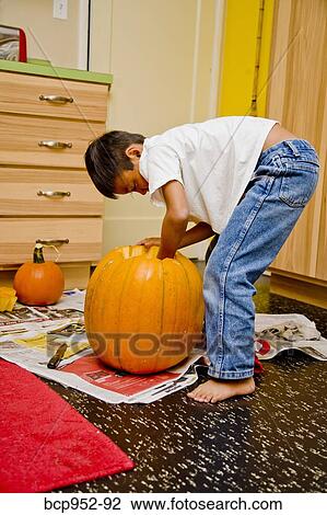 boy carving jack o'lantern View Large Photo Image Stock Image - boy carving jack o'lantern. Fotosearch