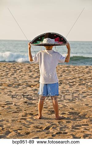 boy on beach wearing sombrero View Large Photo Image Stock Photo - boy on beach wearing sombrero. Fotosearch