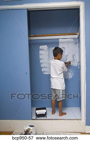 boy painting wall in closet View Large Photo Image Stock Photo - boy painting wall in closet. Fotosearch