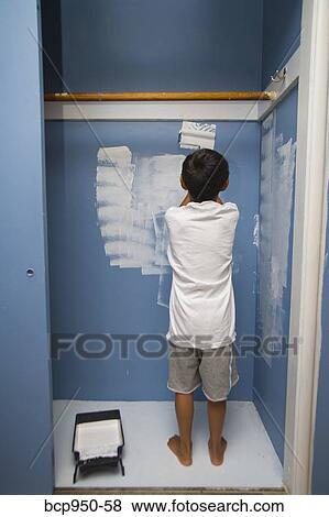 boy painting wall in closet View Large Photo Image Stock Photo - boy painting wall in closet. Fotosearch