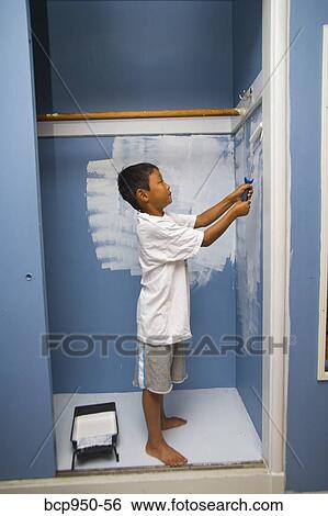 boy painting wall in closet View Large Photo Image Stock Photograph - boy painting wall in closet. Fotosearch