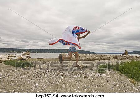 boy running on beach with flying towel View Large Photo Image Picture - boy running on beach with flying towel. Fotosearch