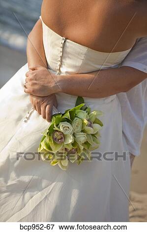 Stock Photo - bridal couple hugging on beach. Fotosearch