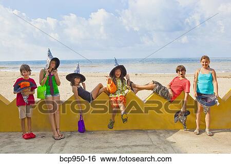 children at beach in witch hats View Large Photo Image Stock Photograph - children at beach in witch hats. Fotosearch