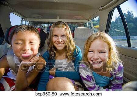 children making faces in car View Large Photo Image Stock Image - children making faces in car. Fotosearch