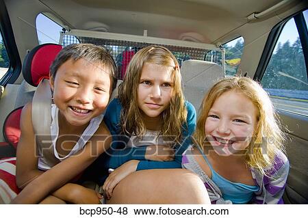 children making faces in car View Large Photo Image Stock Photo - children making faces in car. Fotosearch
