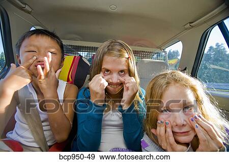 children making faces in car View Large Photo Image Stock Photo - children making faces in car. Fotosearch