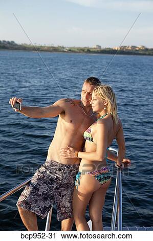 couple taking photo of themselves View Large Photo Image Stock Image - couple taking photo of themselves. Fotosearch