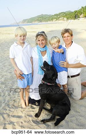family on beach with dog View Large Photo Image Picture - family on beach with dog. Fotosearch