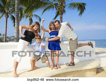 family posing as superheroes View Large Photo Image Stock Photo - family posing as superheroes. Fotosearch