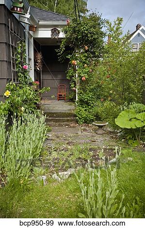 front porch and garden of brown house View Large Photo Image Stock Photo - front porch and garden of brown house. Fotosearch