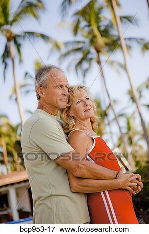 middle aged couple with palm trees View Large Photo Image Stock Photo - middle aged couple with palm trees. Fotosearch