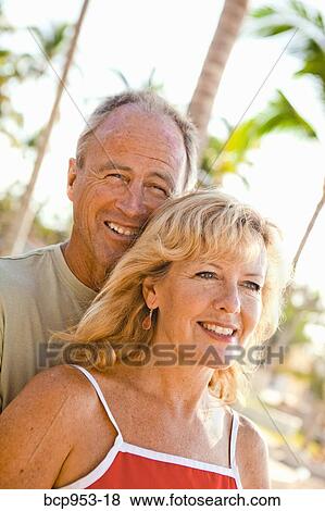 middle aged couple with palm trees View Large Photo Image Stock Photo - middle aged couple with palm trees. Fotosearch