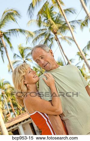 middle aged couple with palm trees View Large Photo Image Stock Photography - middle aged couple with palm trees. Fotosearch