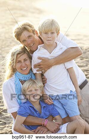 Stock Photo - portrait of family on beach. Fotosearch