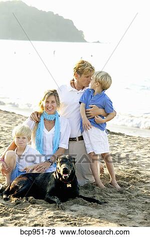 portrait of family on beach with dogs View Large Photo Image Stock Photo - portrait of family on beach with dogs. Fotosearch