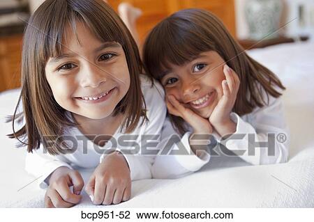 portrait of two smiling young girls View Large Photo Image Stock Image - portrait of two smiling young girls. Fotosearch