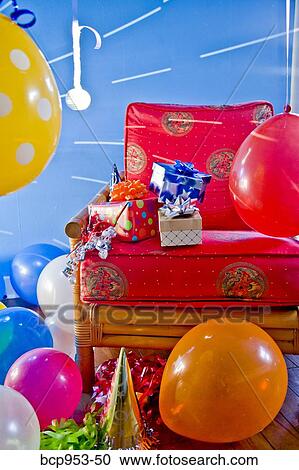 red chair with gifts and balloons View Large Photo Image Stock Image - red chair with gifts and balloons. Fotosearch