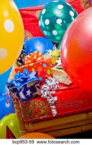 red chair with gifts and balloons View Large Photo Image Stock Photo - red chair with gifts and balloons. Fotosearch
