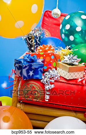 red chair with gifts and balloons View Large Photo Image Stock Photography - red chair with gifts and balloons. Fotosearch