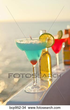 row of cocktails on boat rail View Large Photo Image Picture - row of cocktails on boat rail. Fotosearch