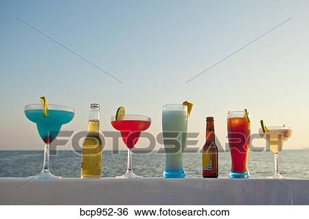 row of cocktails on boat rail View Large Photo Image Stock Photograph - row of cocktails on boat rail. Fotosearch