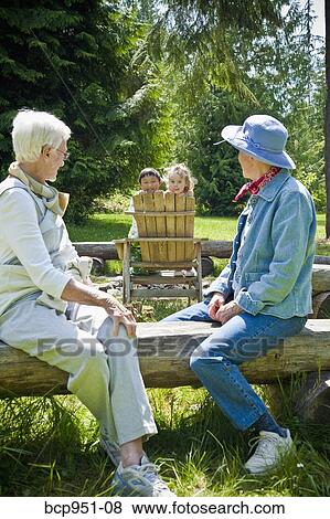 senior women looking at two children View Large Photo Image Stock Photo - senior women looking at two children. Fotosearch