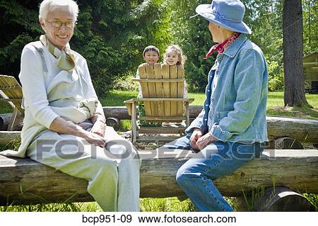 senior women looking at two children View Large Photo Image Stock Photo - senior women looking at two children. Fotosearch