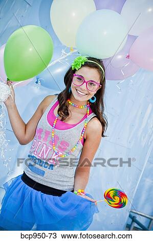 teen girl holding bunch of balloons View Large Photo Image Stock Image - teen girl holding bunch of balloons. Fotosearch