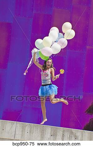 teen girl holding bunch of balloons View Large Photo Image Stock Photography - teen girl holding bunch of balloons. Fotosearch