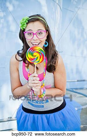 teen girl with large lollipop View Large Photo Image Stock Image - teen girl with large lollipop. Fotosearch