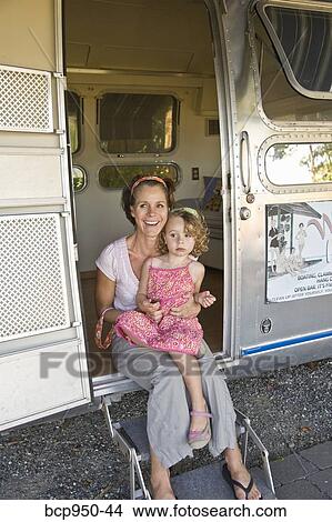woman and girl in door of camper View Large Photo Image Picture - woman and girl in door of camper. Fotosearch