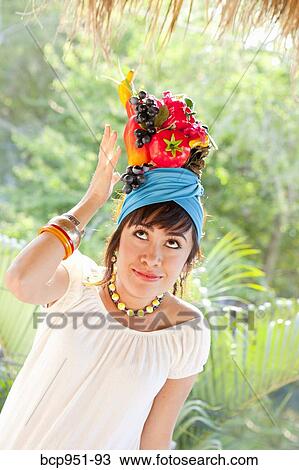young woman wearing fruit hat View Large Photo Image Stock Image - young woman wearing fruit hat. Fotosearch