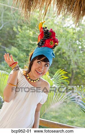 young woman wearing fruit hat View Large Photo Image Stock Image - young woman wearing fruit hat. Fotosearch