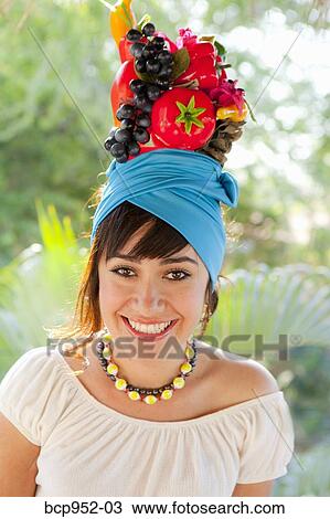 young woman wearing fruit hat View Large Photo Image Stock Image - young woman wearing fruit hat. Fotosearch