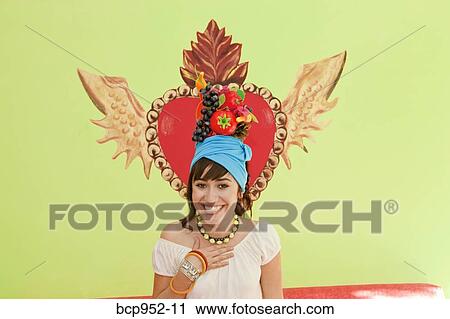 young woman wearing fruit hat View Large Photo Image Stock Image - young woman wearing fruit hat. Fotosearch